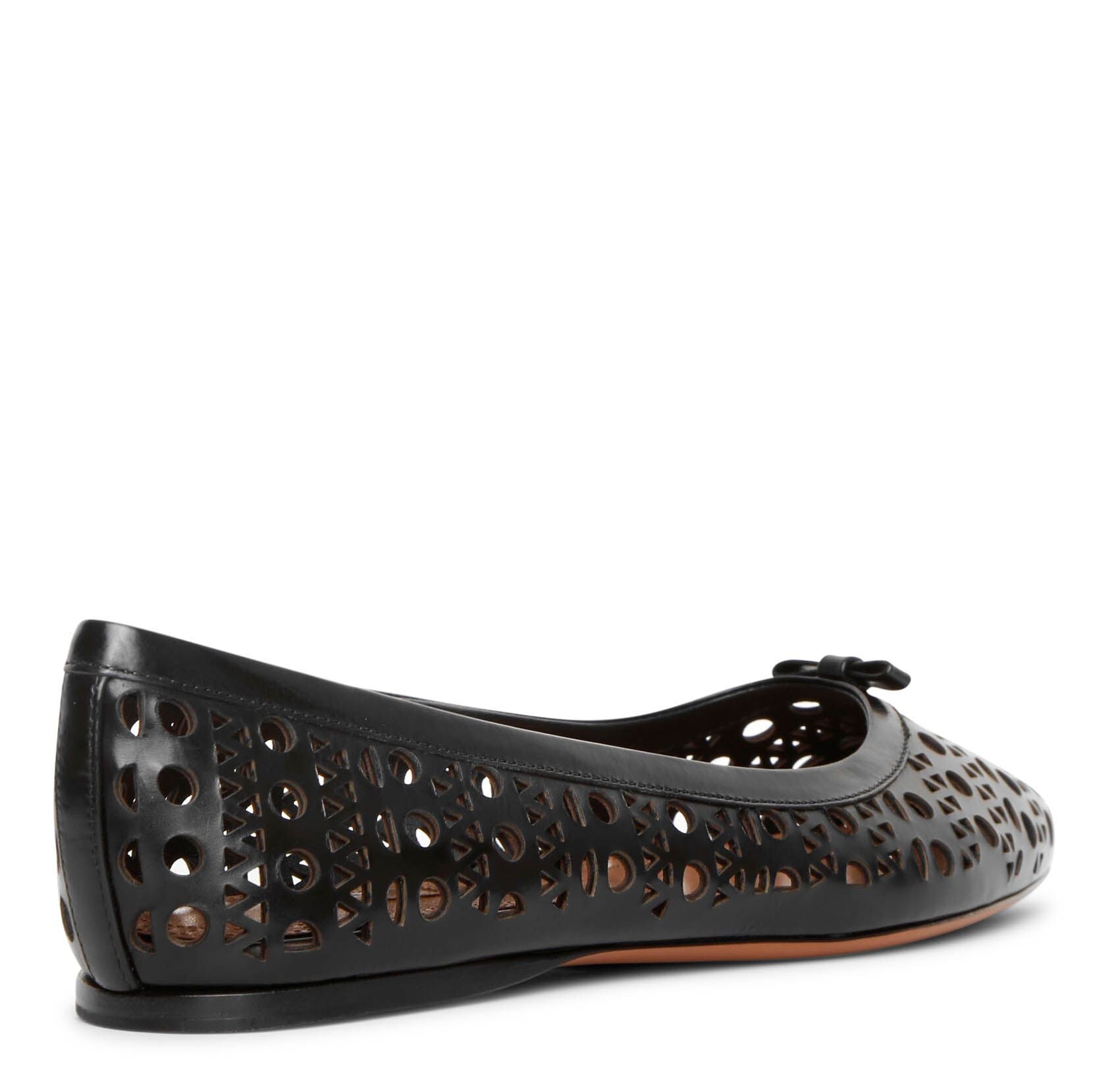 Pointed black leather ballet flats