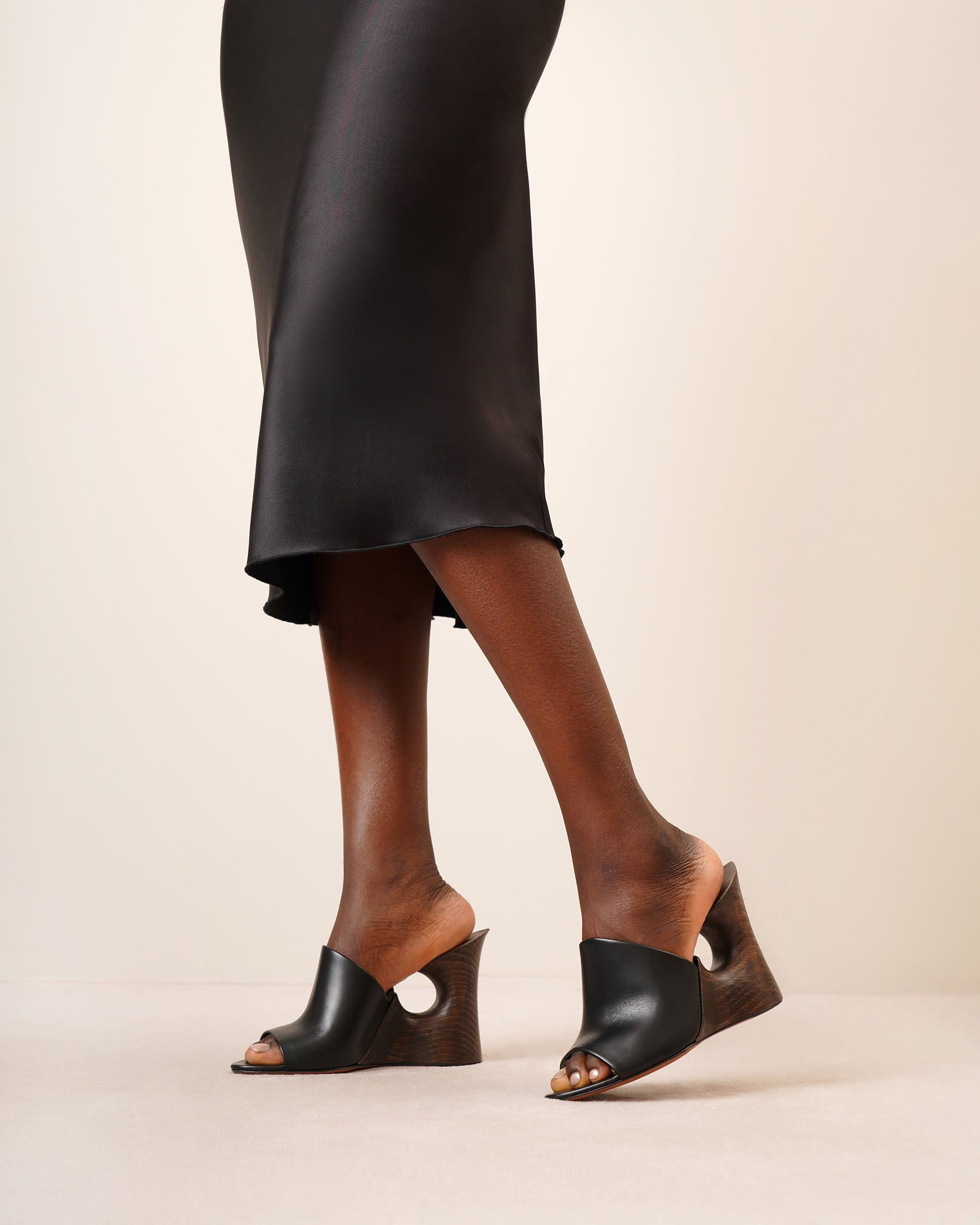 La Sculpture black leather wedge mules