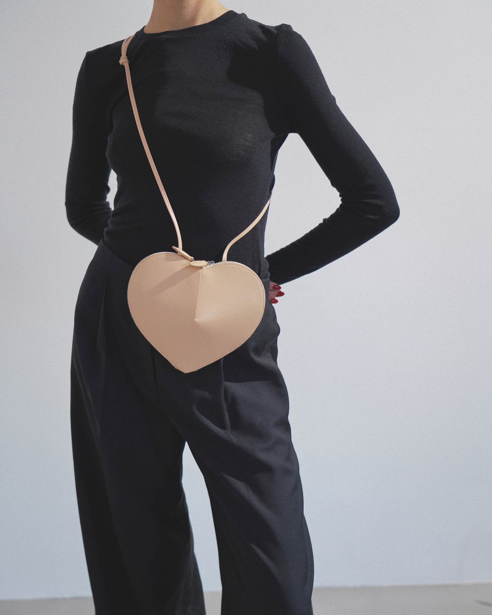 Le Coeur beige leather crossbody bag