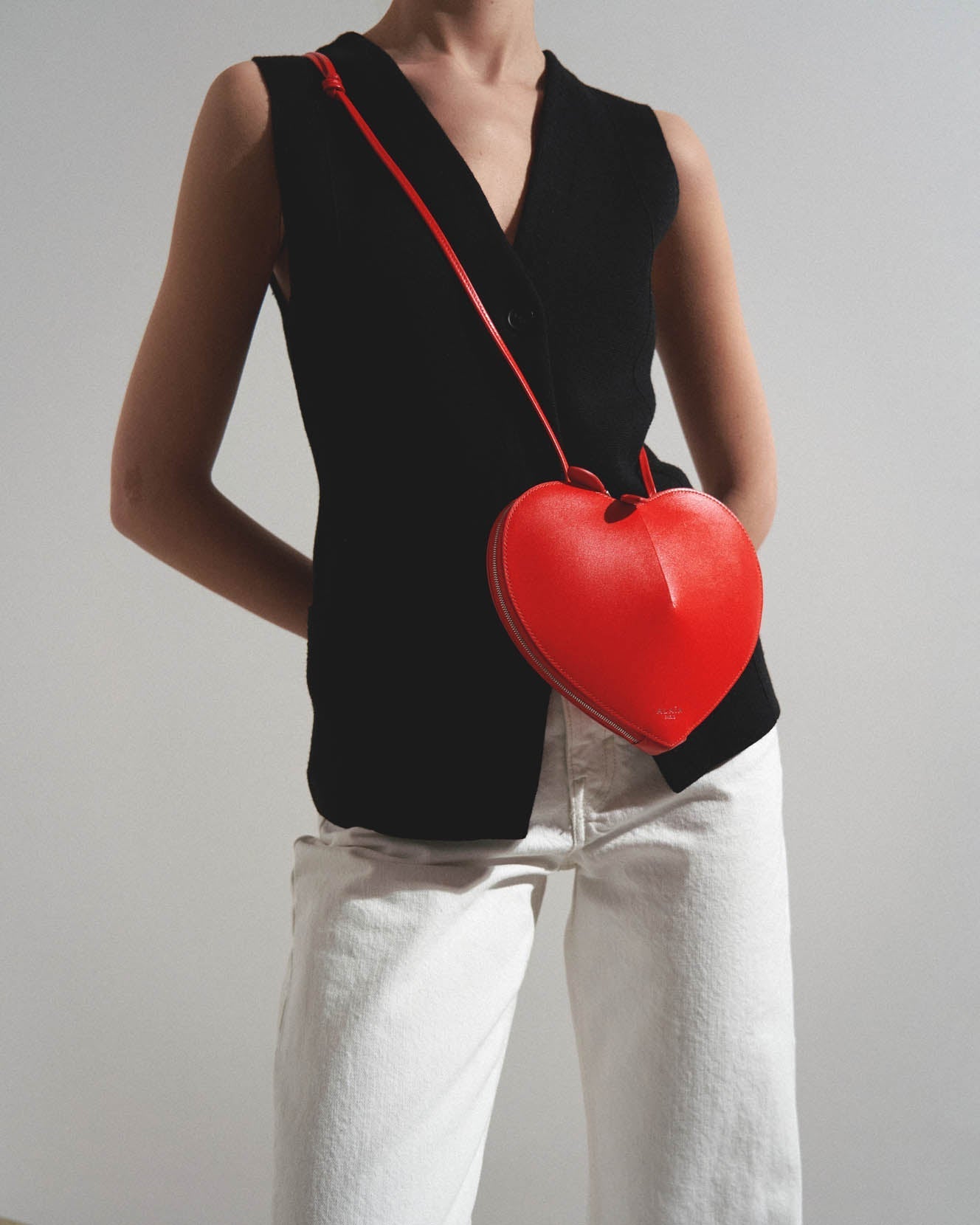 Le Coeur orange leather crossbody bag