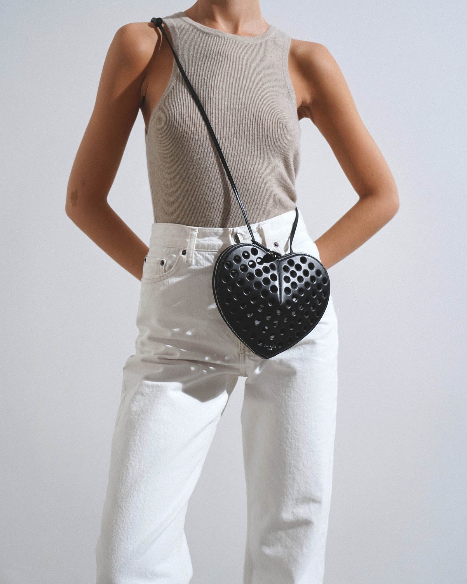 Le Coeur black perforated crossbody bag