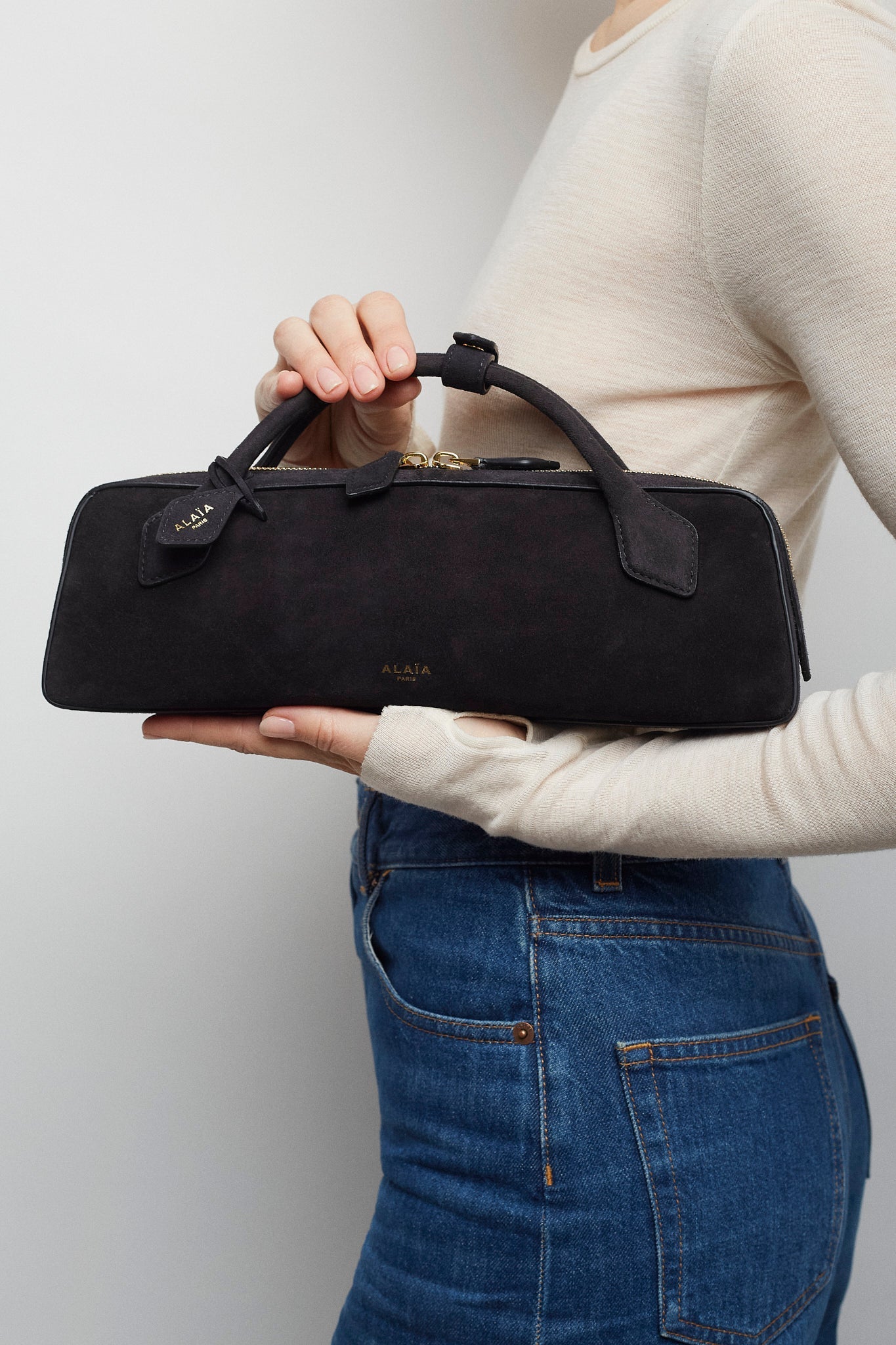 Le Teckel black suede clutch