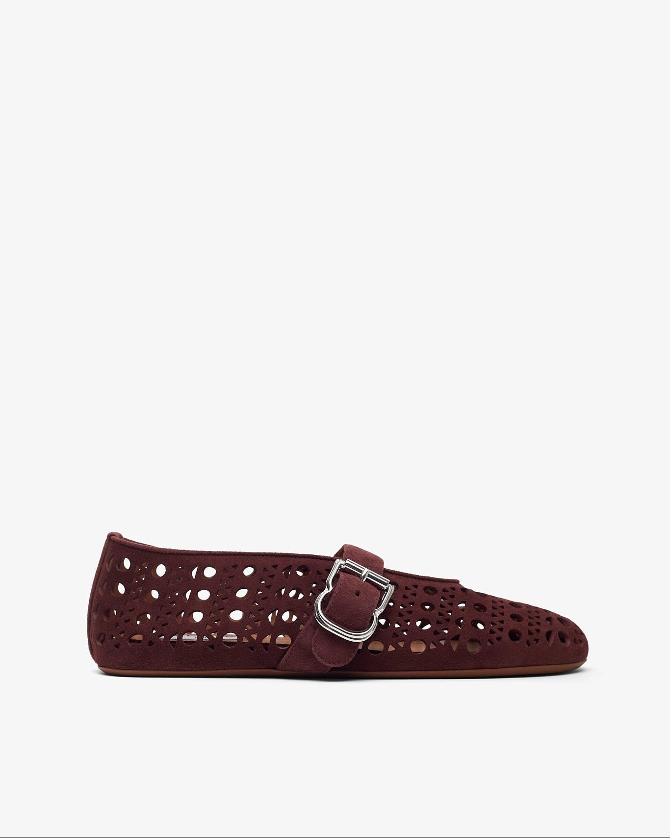 Black leather loafers on a light gray background