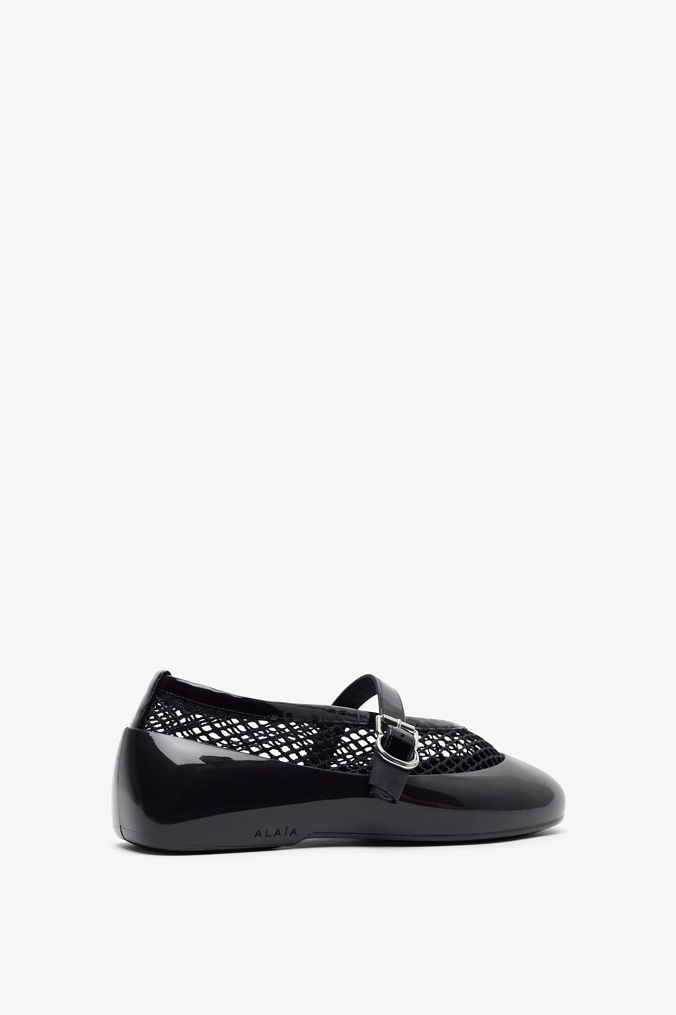 Black rubber ballet flats