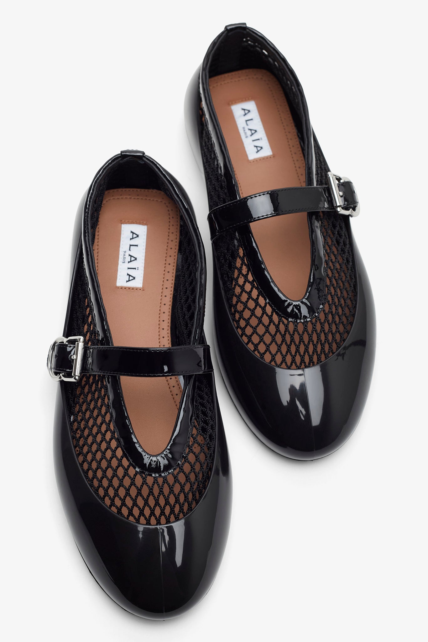 Black rubber ballet flats