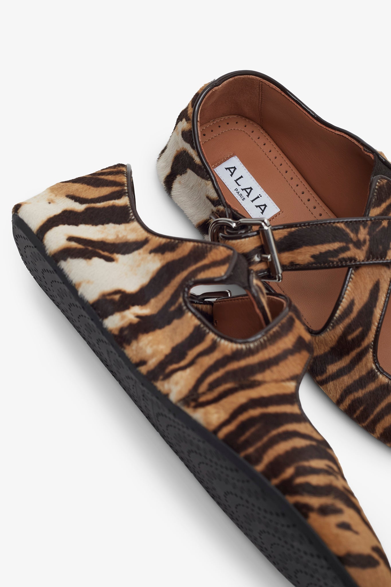 Criss cross brown and beige ballet flats