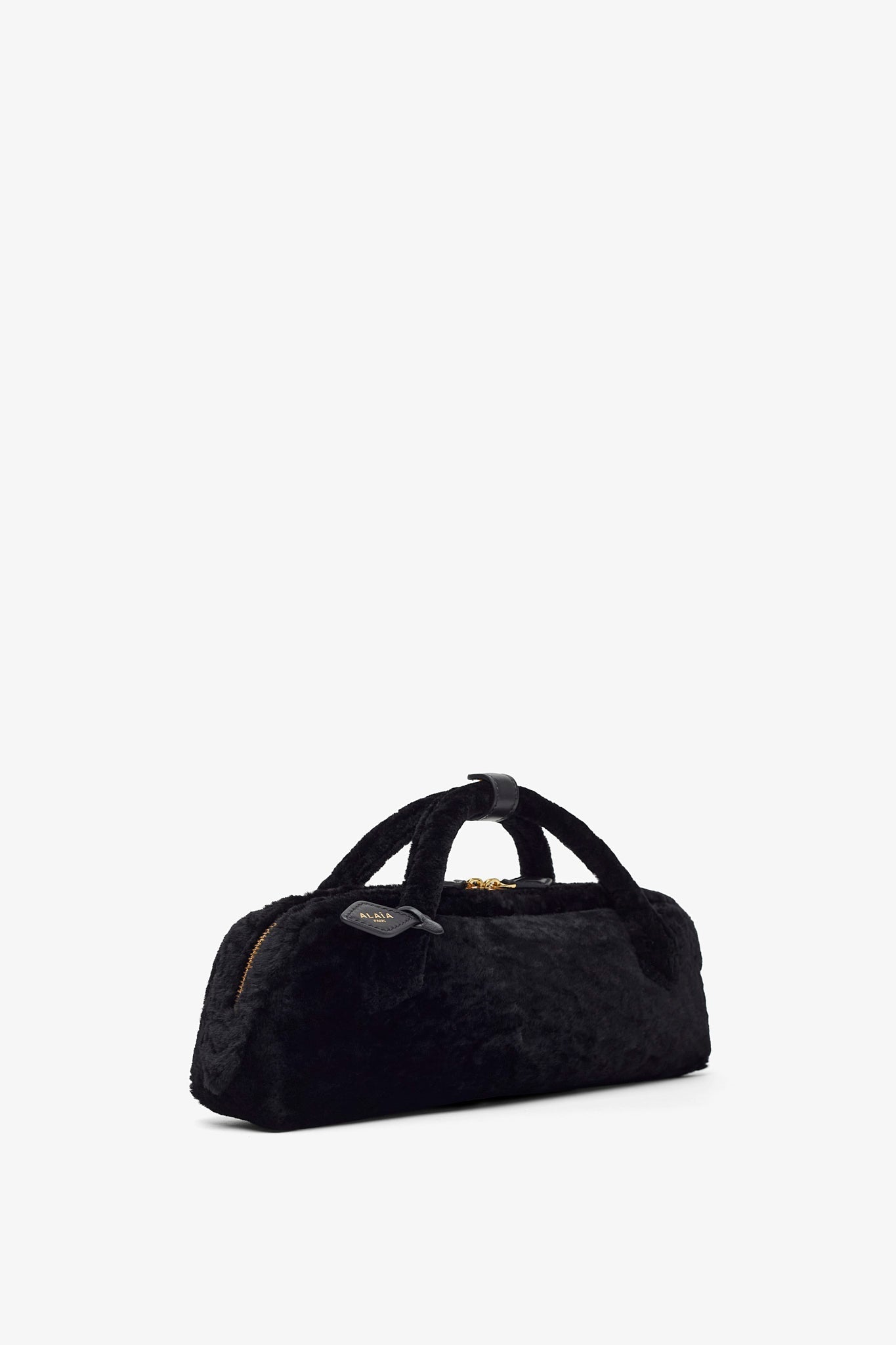 Le Teckel black shearling clutch