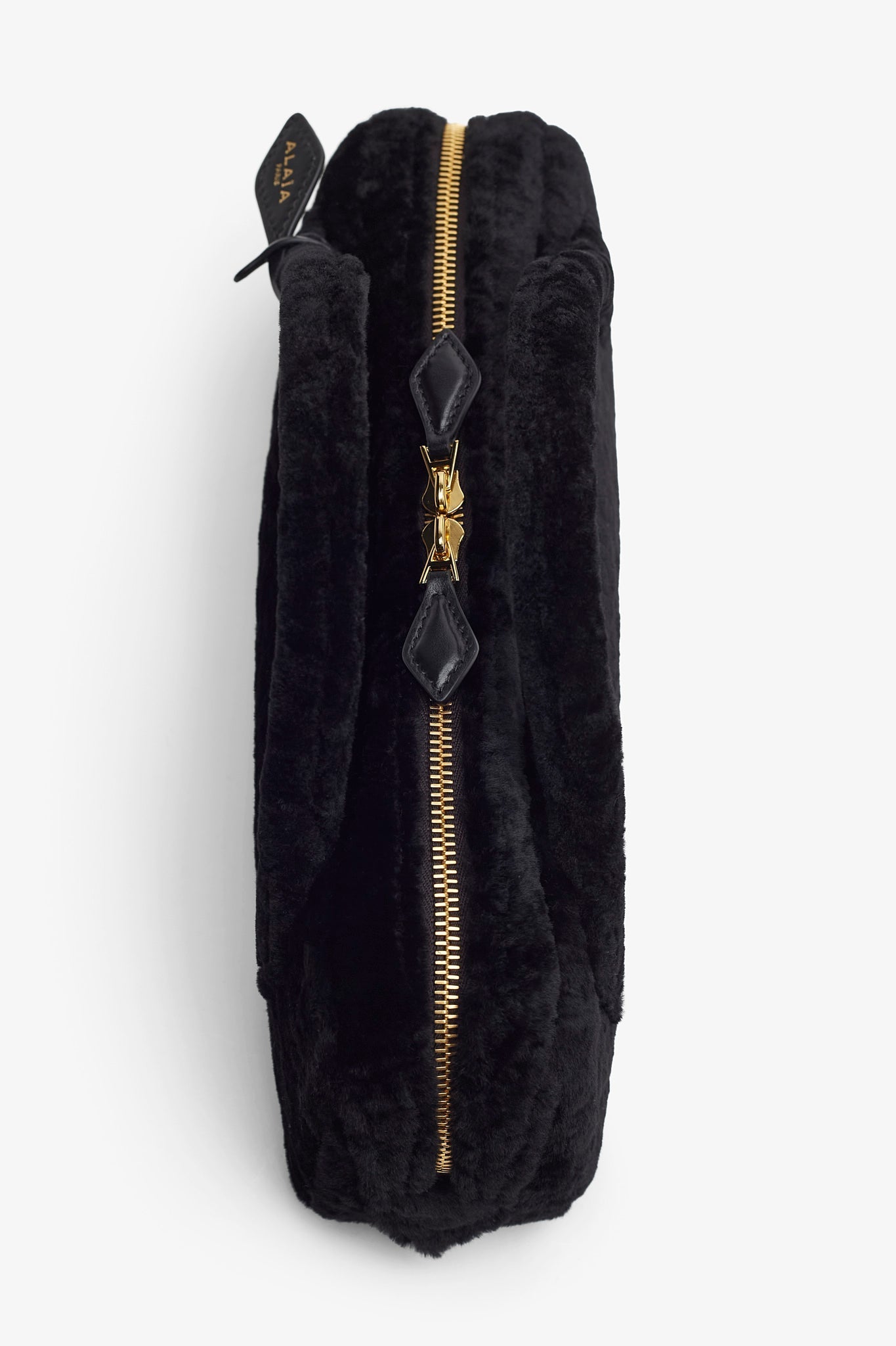Le Teckel black shearling clutch