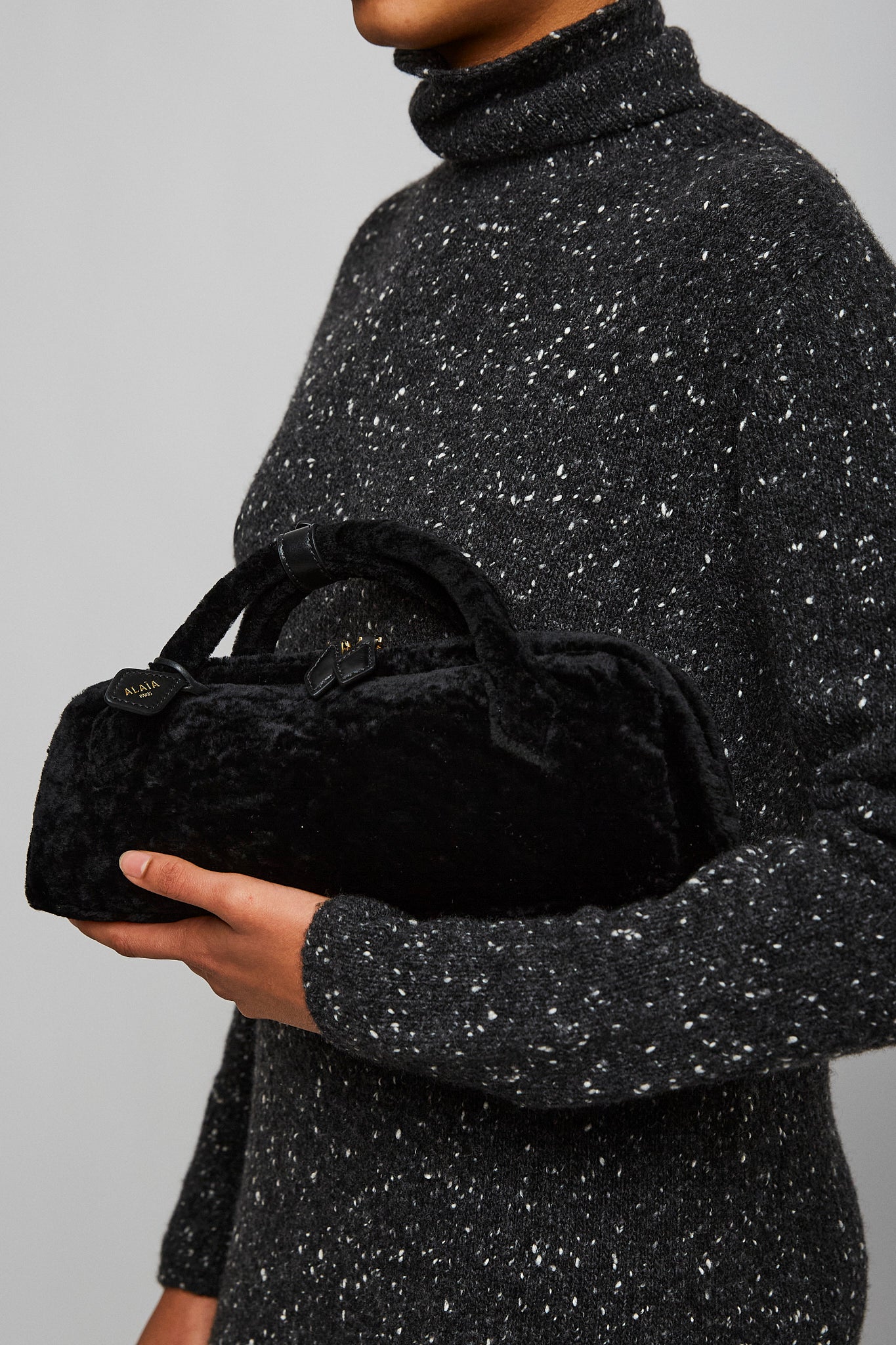 Le Teckel black shearling clutch