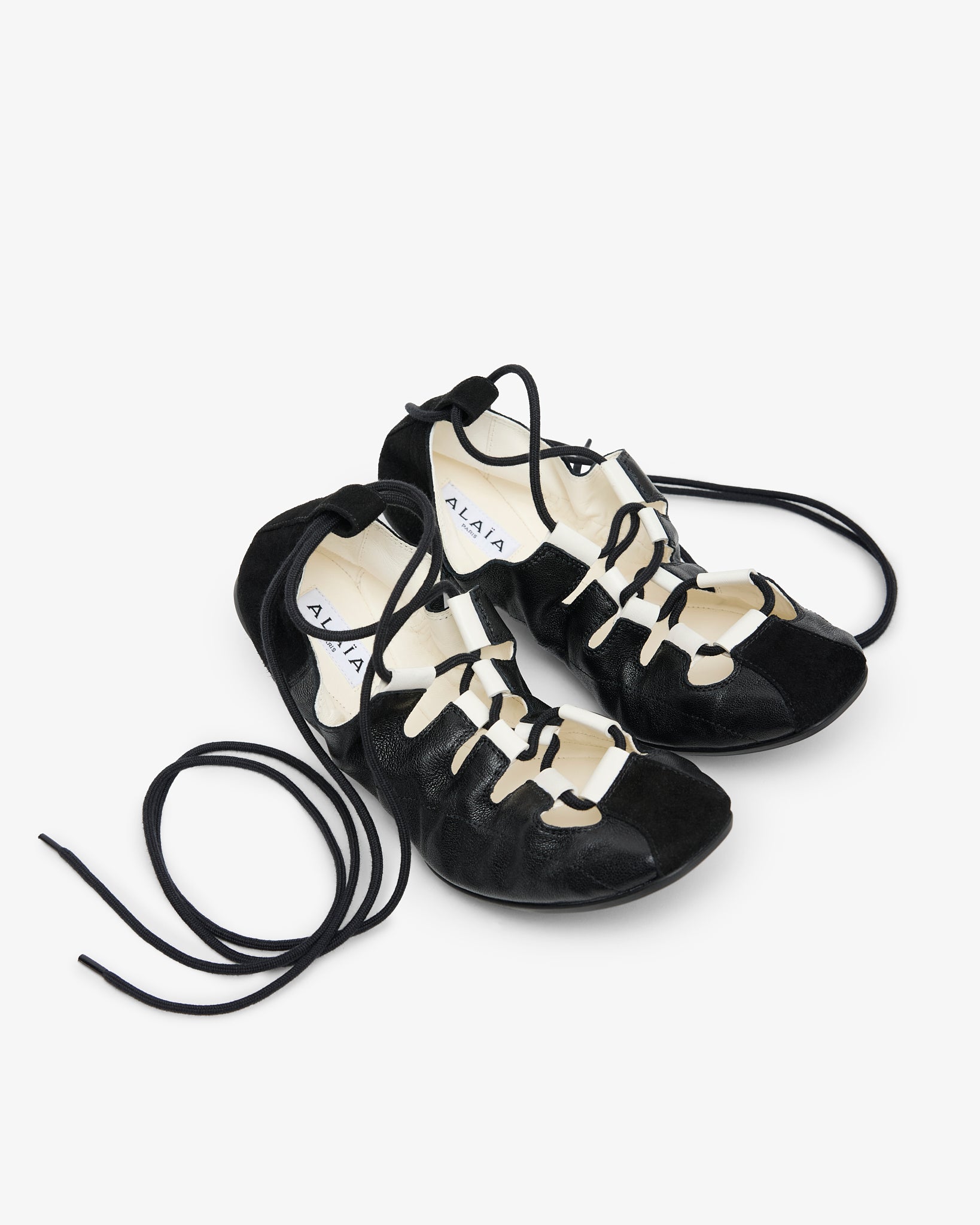 Laced black leather ballet flats