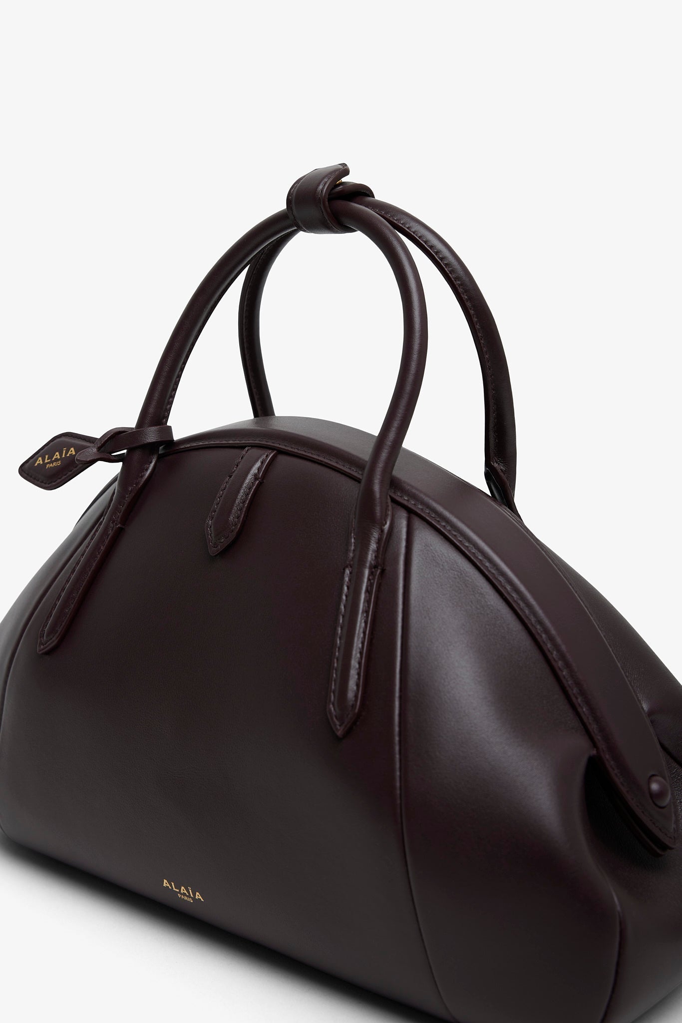 Top handle small burgundy bag