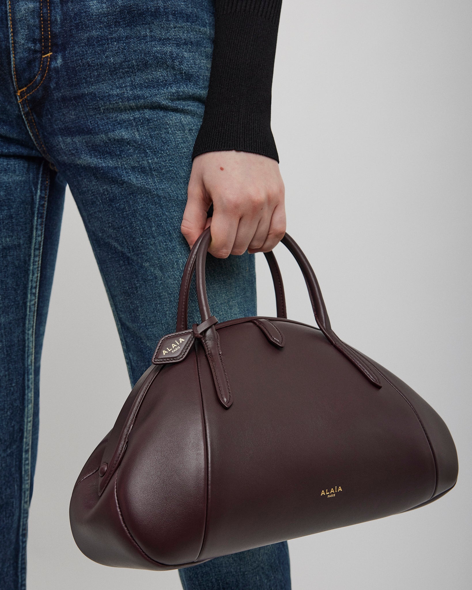 Top handle small burgundy bag
