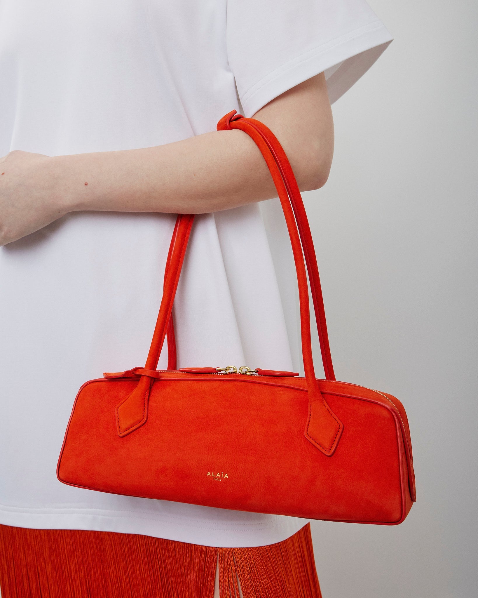 Le Teckel Medium orange suede bag