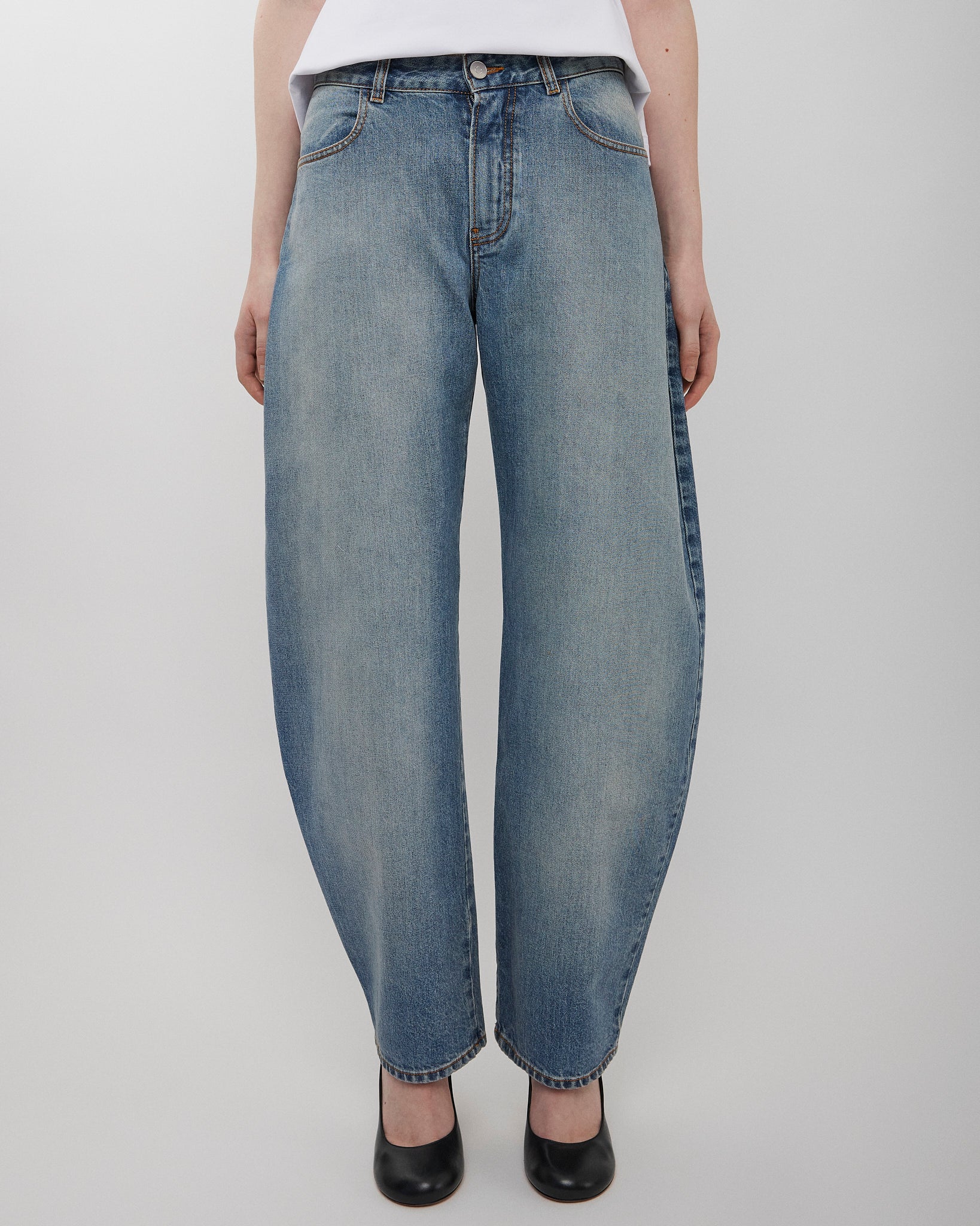 Round faded blue jeans