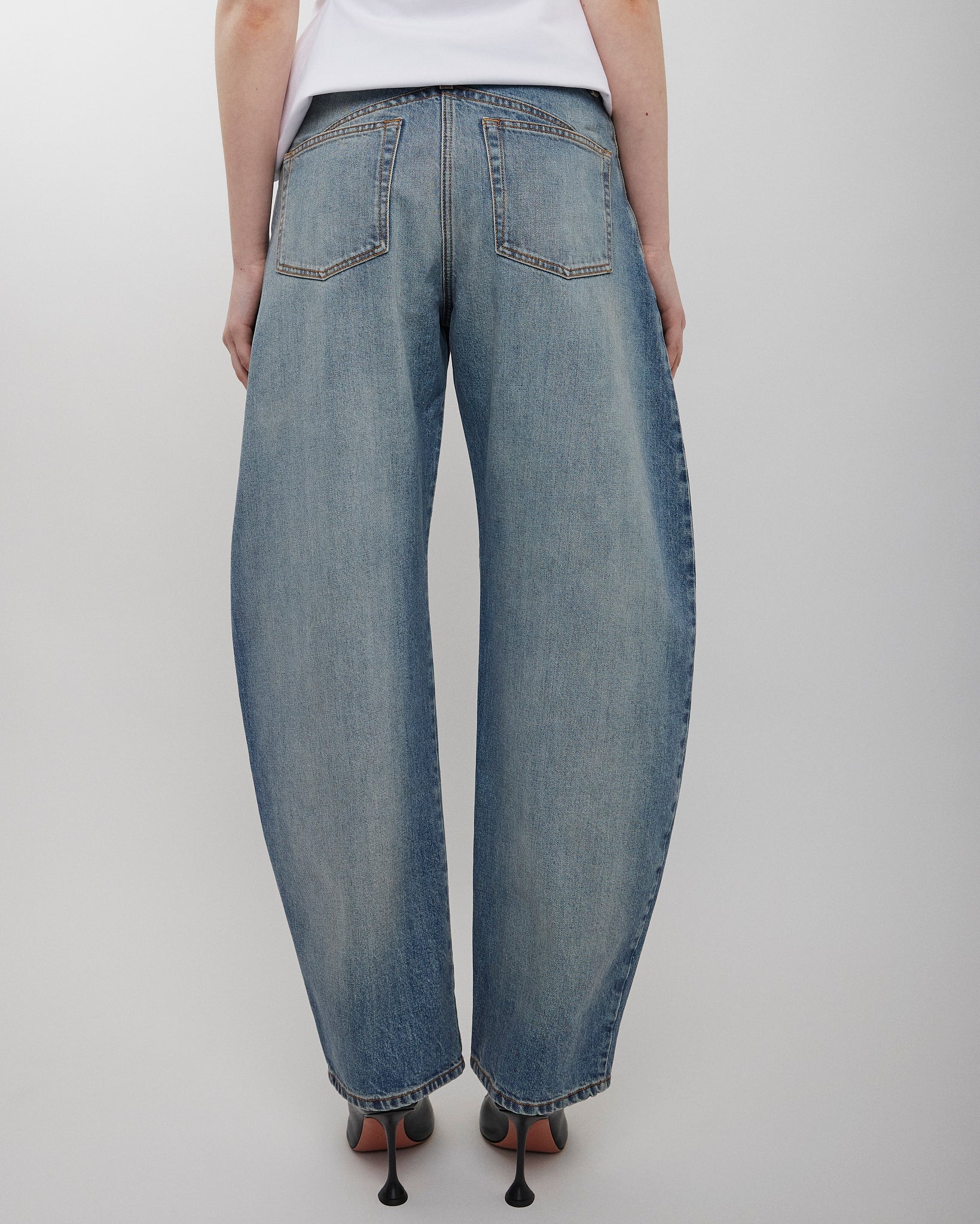 Round faded blue jeans