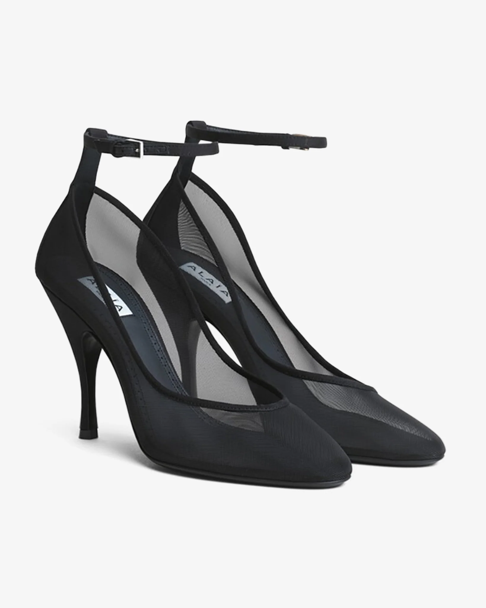 Transparent black strappy pumps