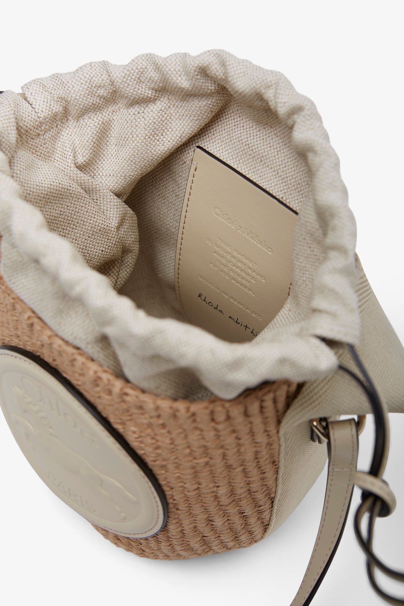 Horse medal ivory raffia bucket bag