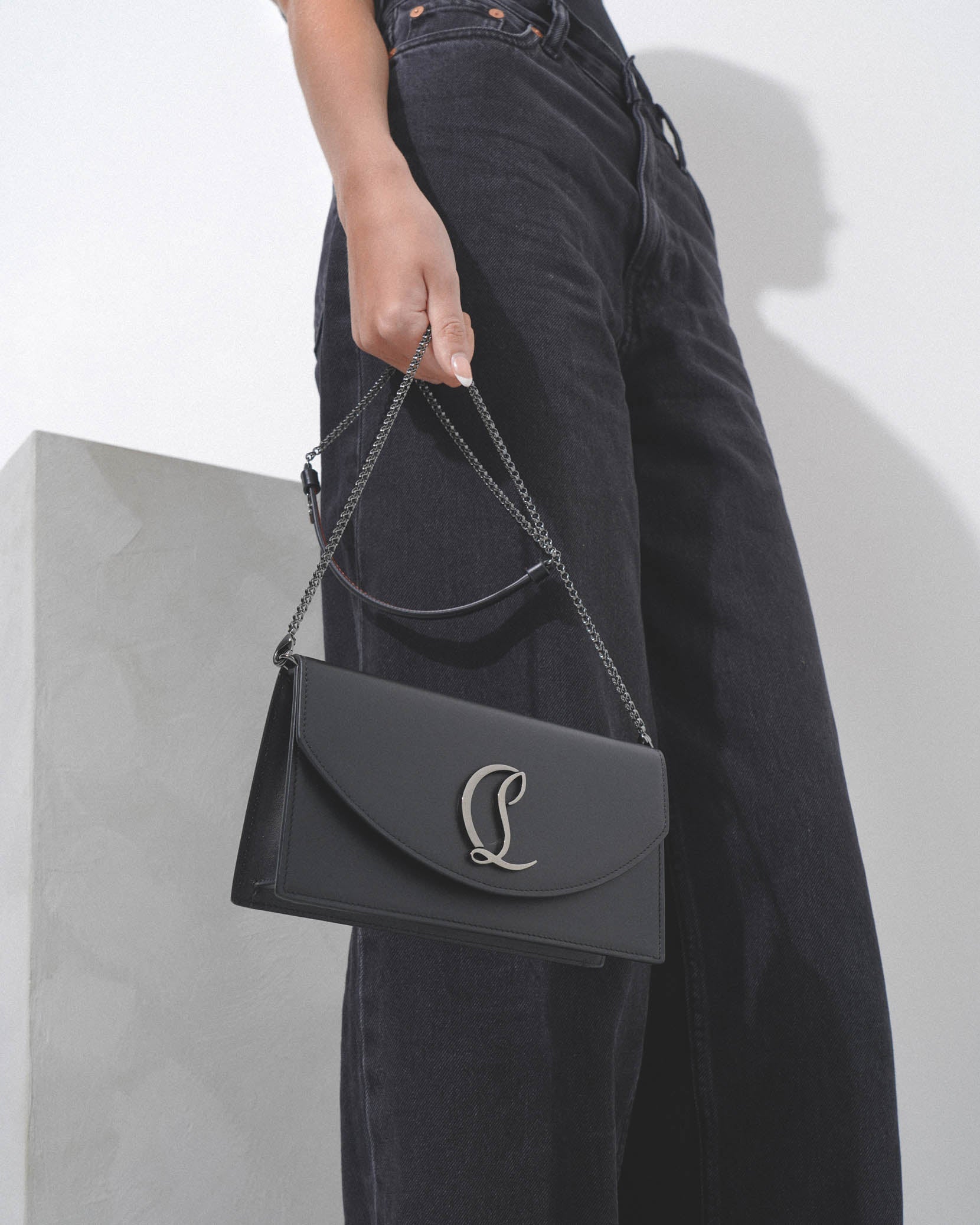 Loubi54 black leather clutch bag