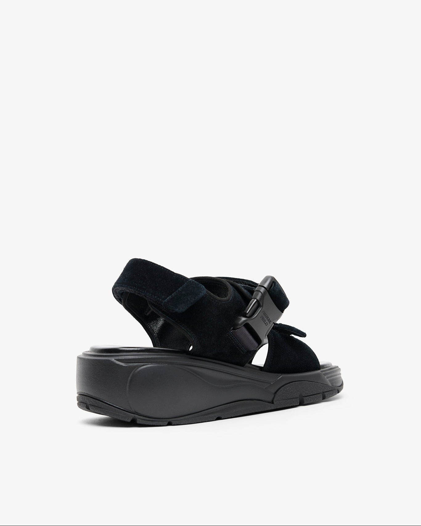 Black sandal with a strap on a white background