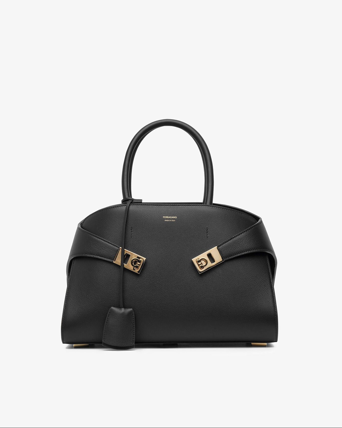 Black handbag with gold accents on a white background