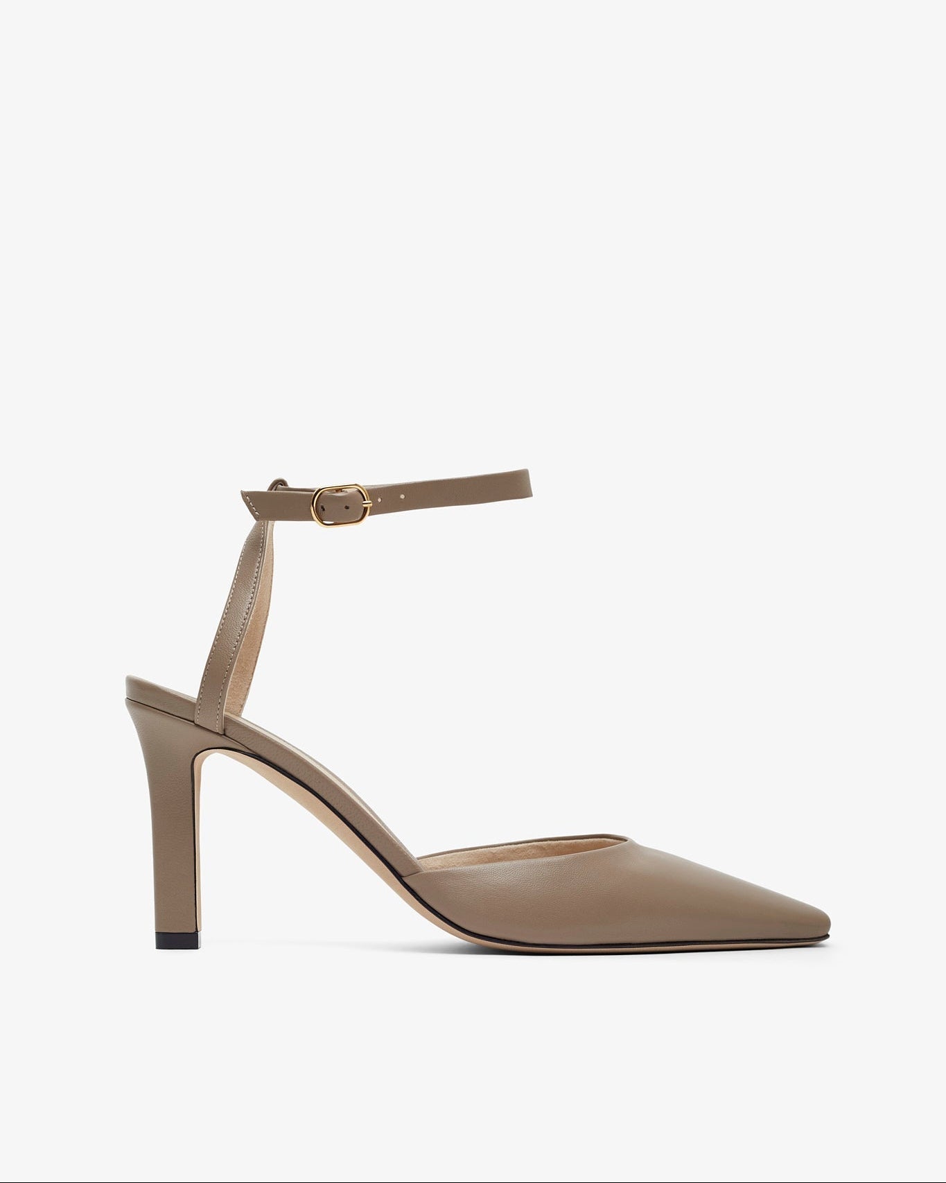Beige high-heeled shoe with a thin strap on a white background