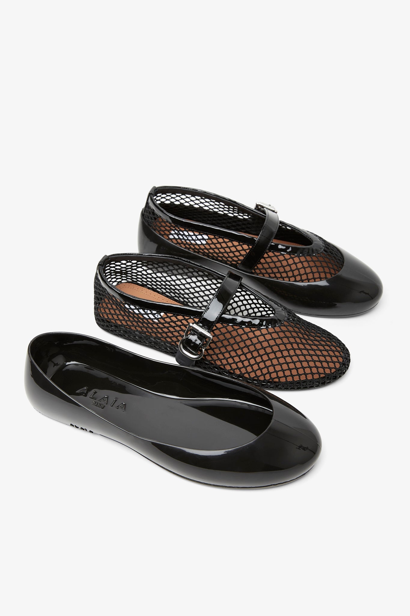 Black rubber ballet flats