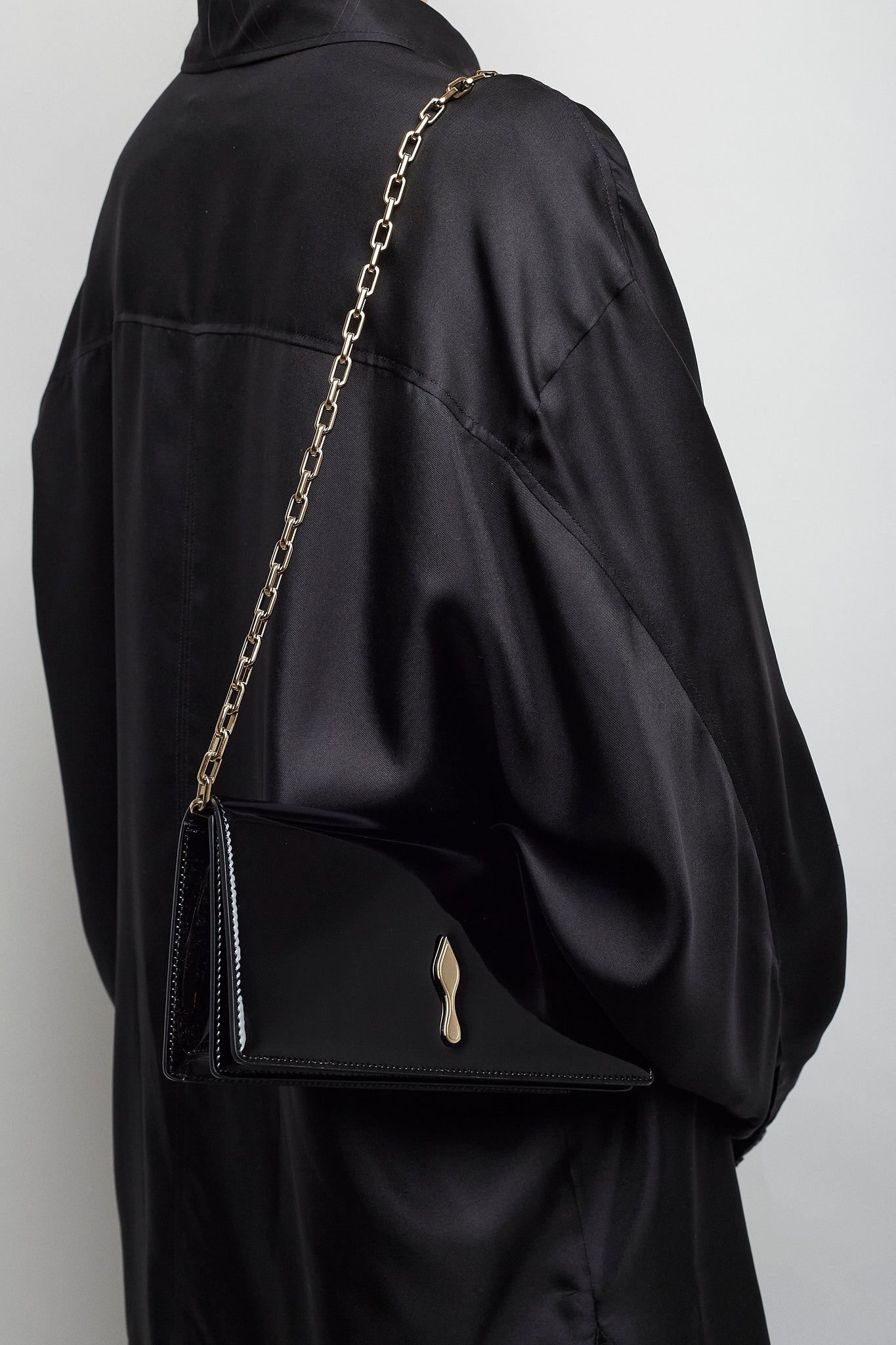 Bettina black patent clutch
