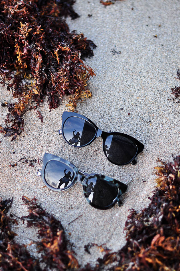 Warby Parker Banks and Piper Sunglasses on the sand 