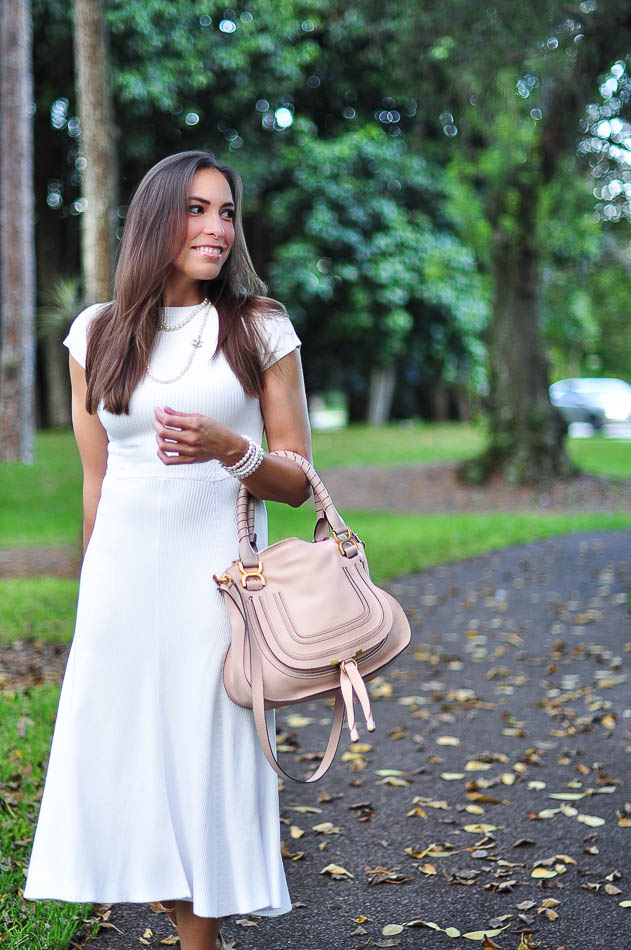 Best Luxury Designers Handbags wearing a Zara white midi dress and Chloe Marcie bag