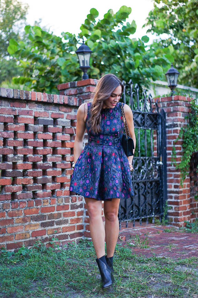 Amanda wearing a Cynthia Rowley floral dress and ASKA Collection booties