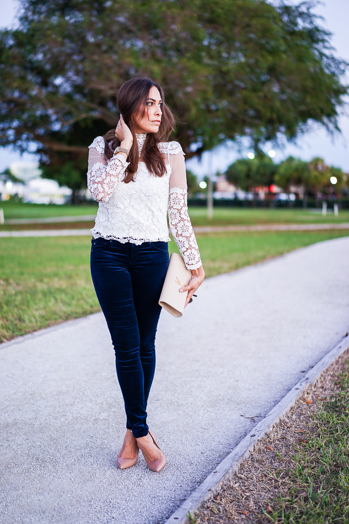 Best Luxury Designers Handbags blogger wearing AG velvet legging jeans with Chicwish lace blouse and YSL monogram clutch