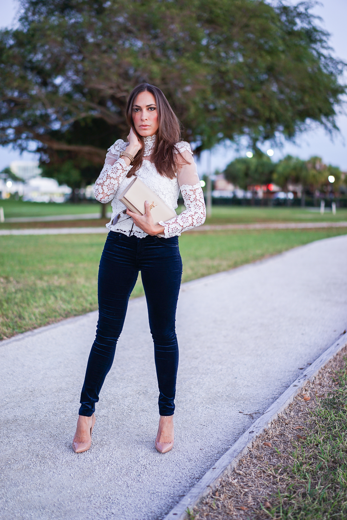 Best Luxury Designers Handbags South Florida blogger wearing whic Chicwish lace top with AG Jeans velvet legging