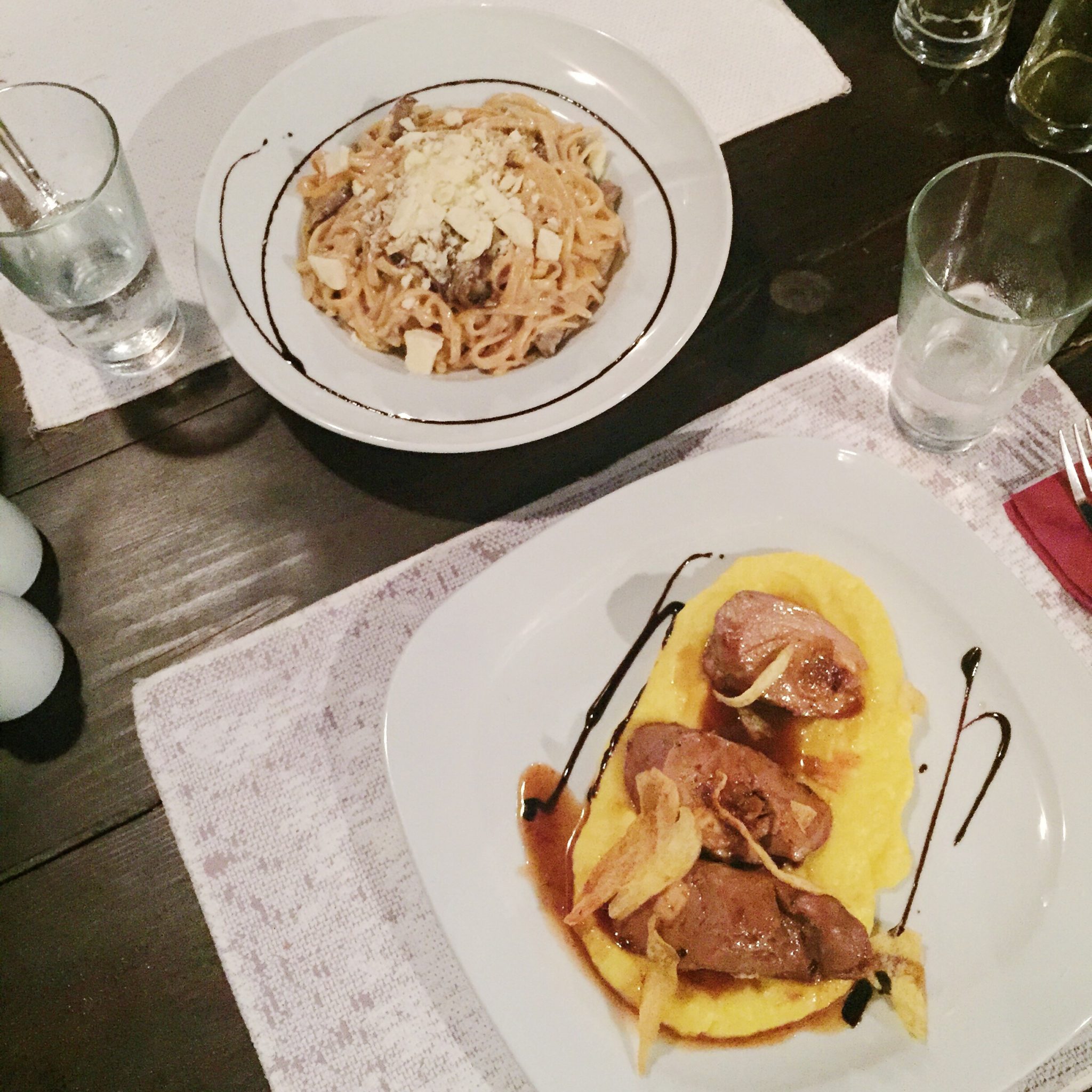 Vinsanto sauce and pasta with mushroom and feta cheese served in Mezzo Restaurant, one of the best Restaurants In Santorini.