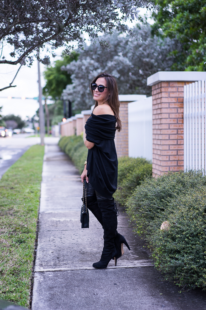 Best Luxury Designers Handbags Blogger Top Quality Luxury Handbag Shop wearing Black cashmere sweater, black leggings, and black boots