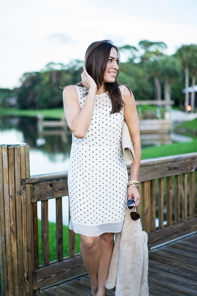 Amanda wearing DVF Abriela studded dress paired with a faux fur Zara jacket