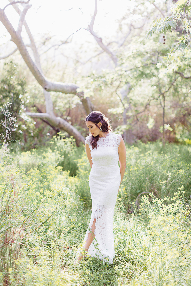 woman wearing white gown for her Malibu Beach Engagement photos