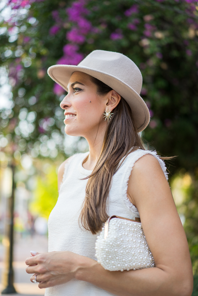 Best Luxury Designers Handbags Blogger Top Quality Luxury Handbag Shop showing her Pearl clutch and Kendra Scott Rogan stud earrings in gold