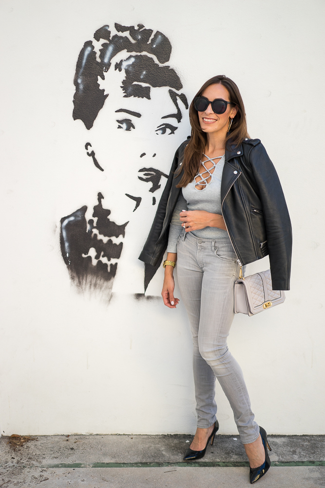 Best Luxury Designers Handbags Blogger Top Quality Luxury Handbag Shop in a grey Sheinside lace up bodysuit, pants and Maje leather moto jacket