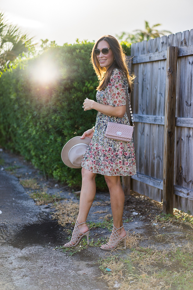 Best Luxury Designers Handbags Blogger Top Quality Luxury Handbag Shop wearing Zara floral dress with Miu Miu bag.