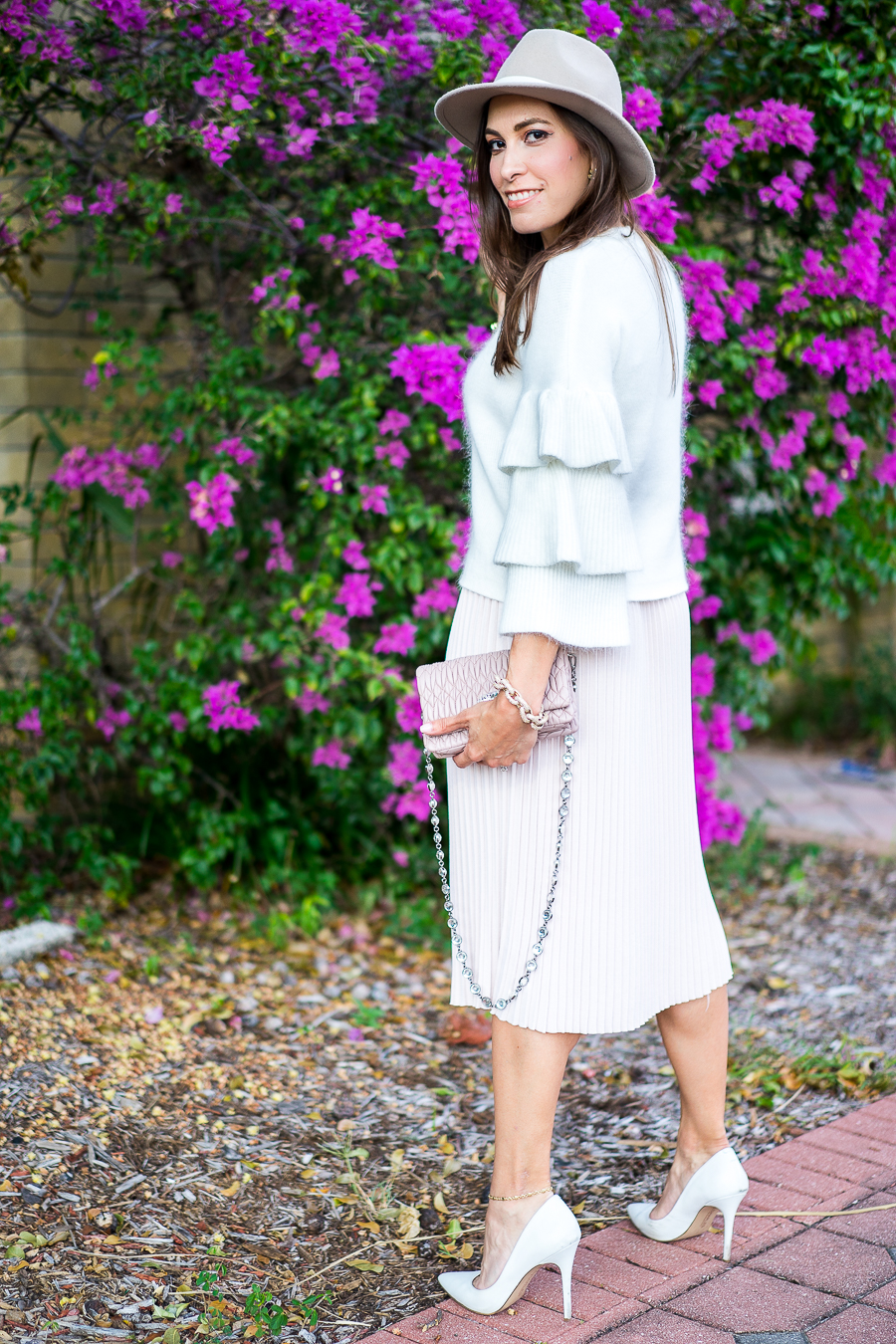 Best Luxury Designers Handbags fashion blogger wearing Endless Rose tiered sleeve sweater and blush pleated midi skirt with Miu Miu bag and white pumps
