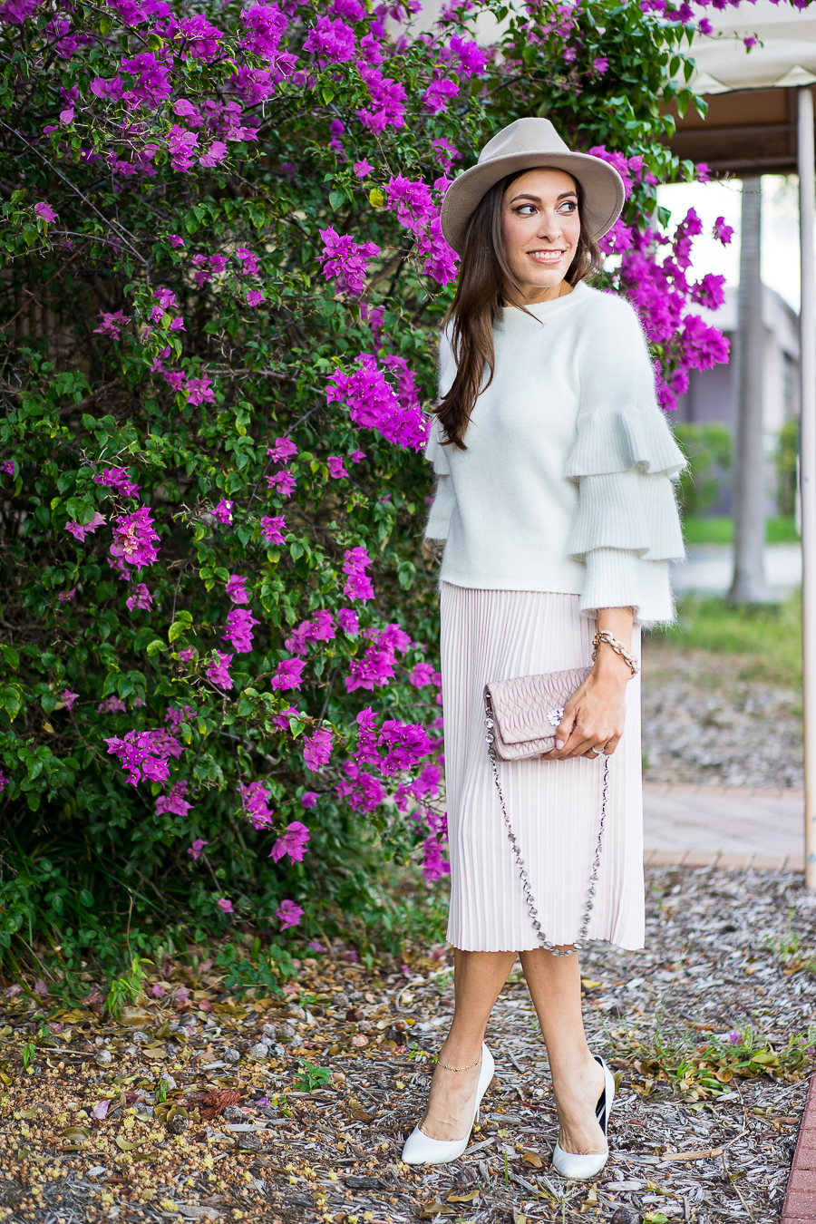 Best Luxury Designers Handbags fashion blogger wearing Endless Rose tiered sleeve sweater and blush pleated midi skirt with Miu Miu bag and white pumps