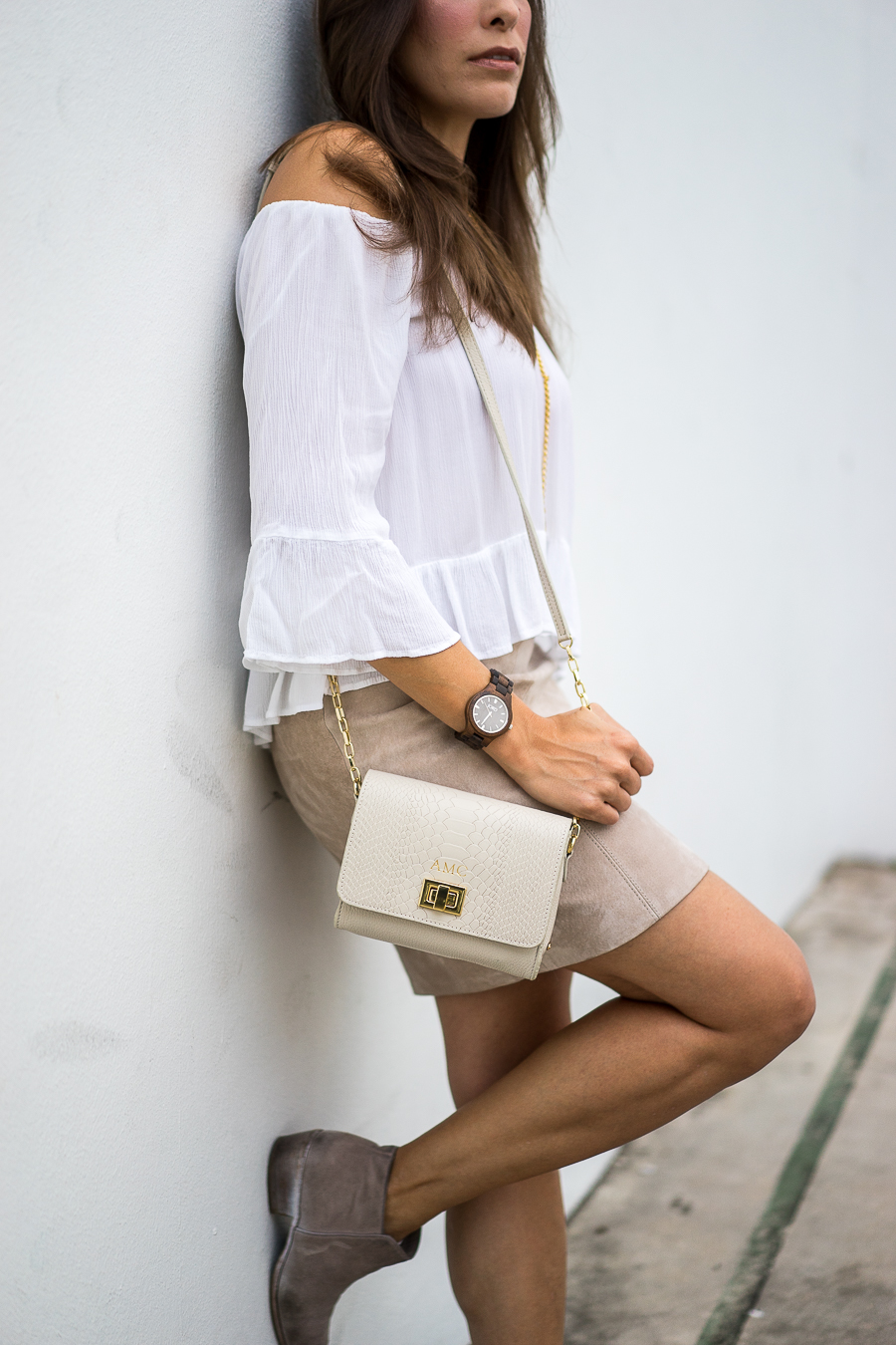 Best Luxury Designers Handbags fashion blogger wears a watch and Gigi New York Catie bag