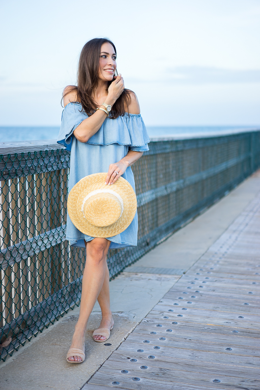 Best Luxury Designers Handbags Blogger Top Quality Luxury Handbag Shop wearing Soft Chambray Denim Dress and holding her Rag and Bone Laurie straw boater hat 