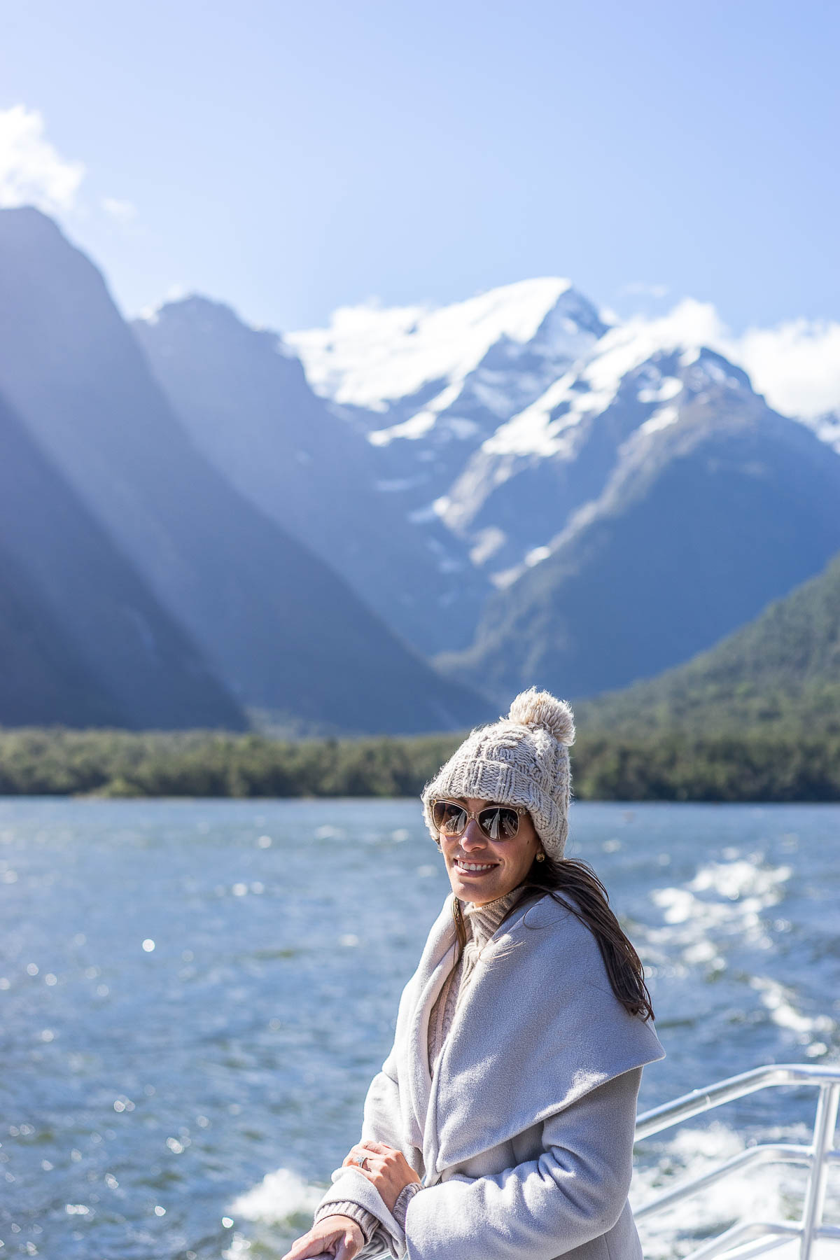 Fashion blogger Amanda from Best Luxury Designers Handbags wears T Tahari marla coat on Milford Sound Cruise in New Zealand