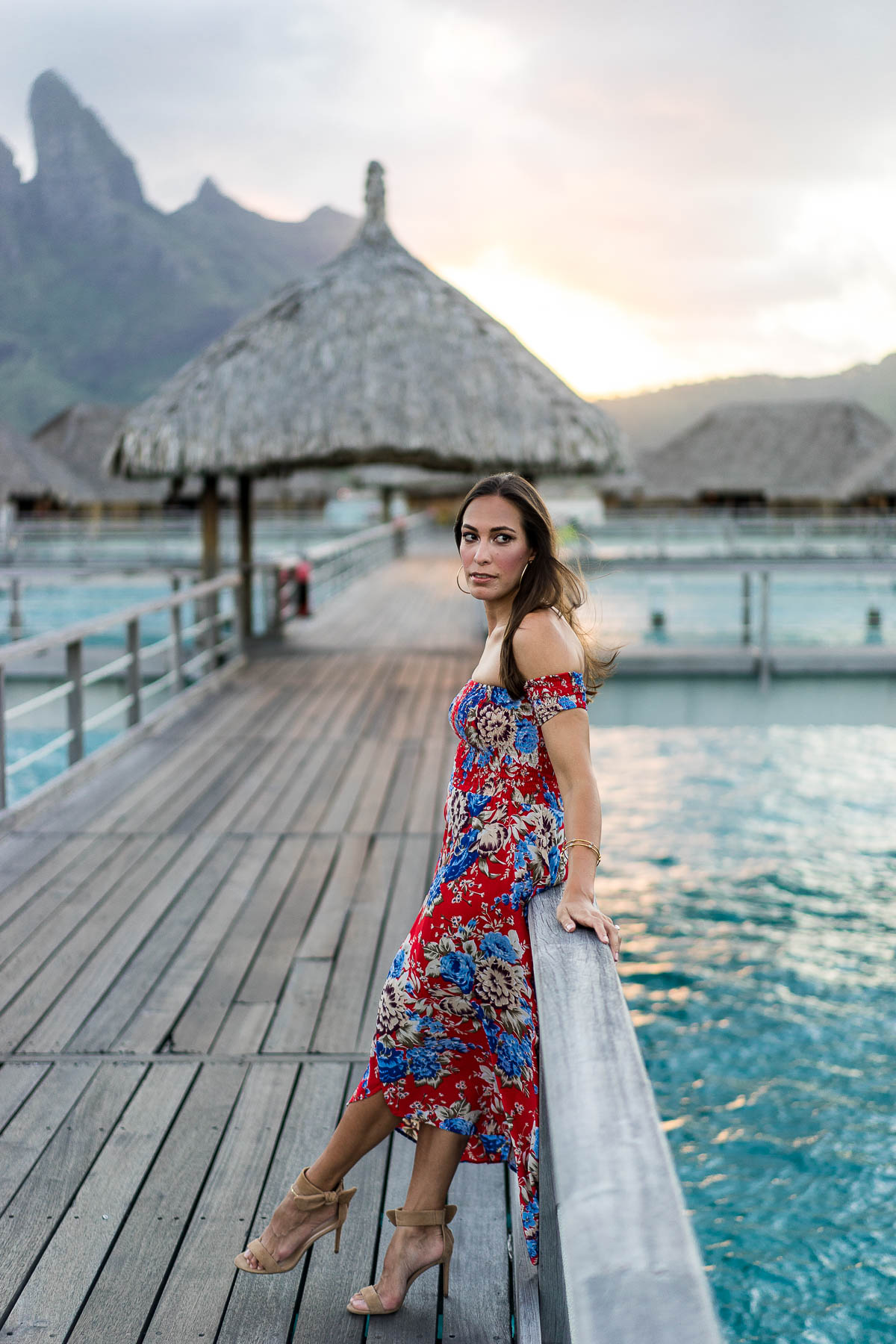 Fashion blogger Amanda from Best Luxury Designers Handbags takes in the sunset at St Regis Bora Bora Resort in Auguste the Label floral maxi dress