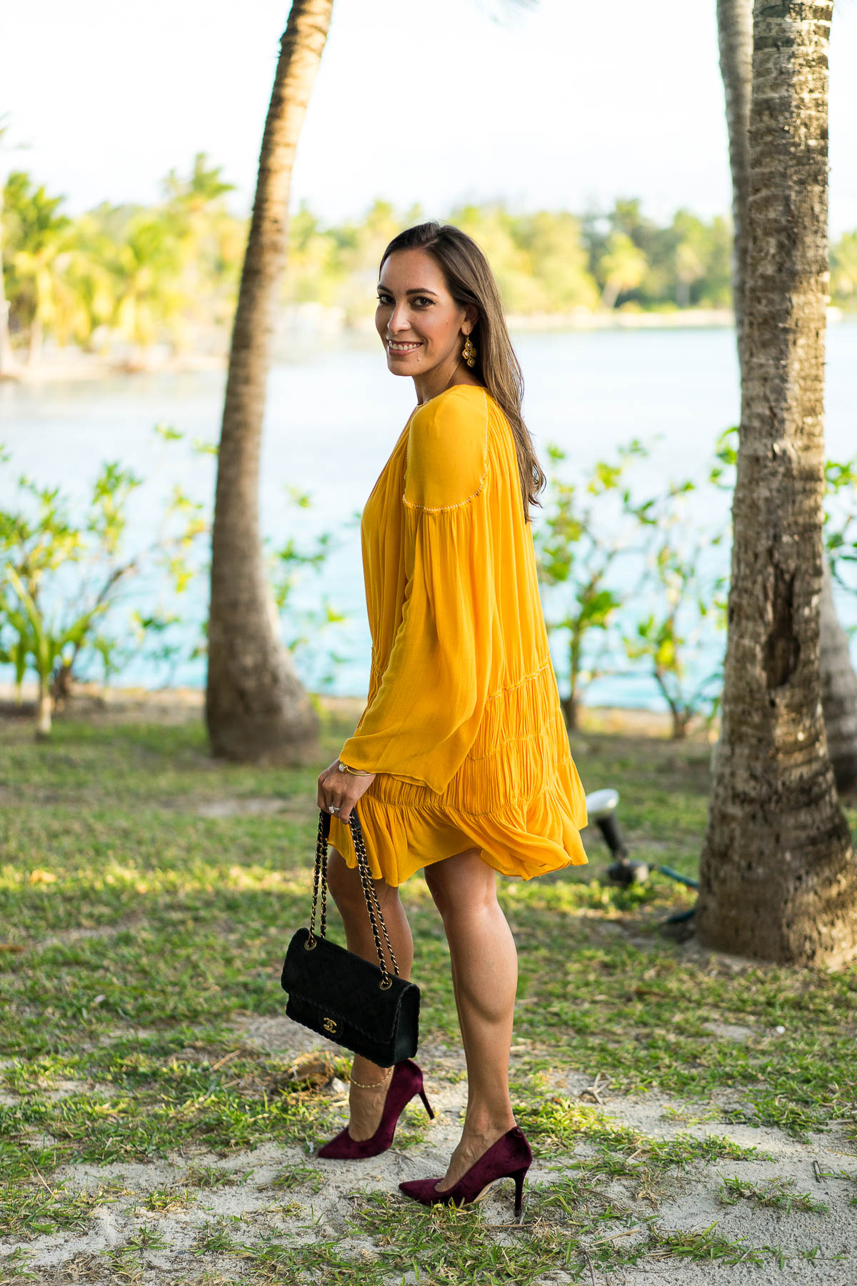 Learn how to style a mustard yellow dress by South Florida fashion blogger Amanda from Best Luxury Designers Handbags