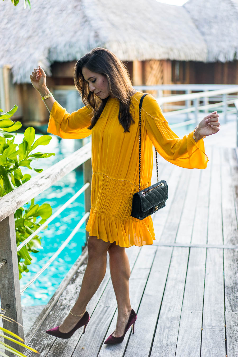Best Luxury Designers Handbags shares what she wore including this mustard yellow dress on her her honeymoon in Bora Bora