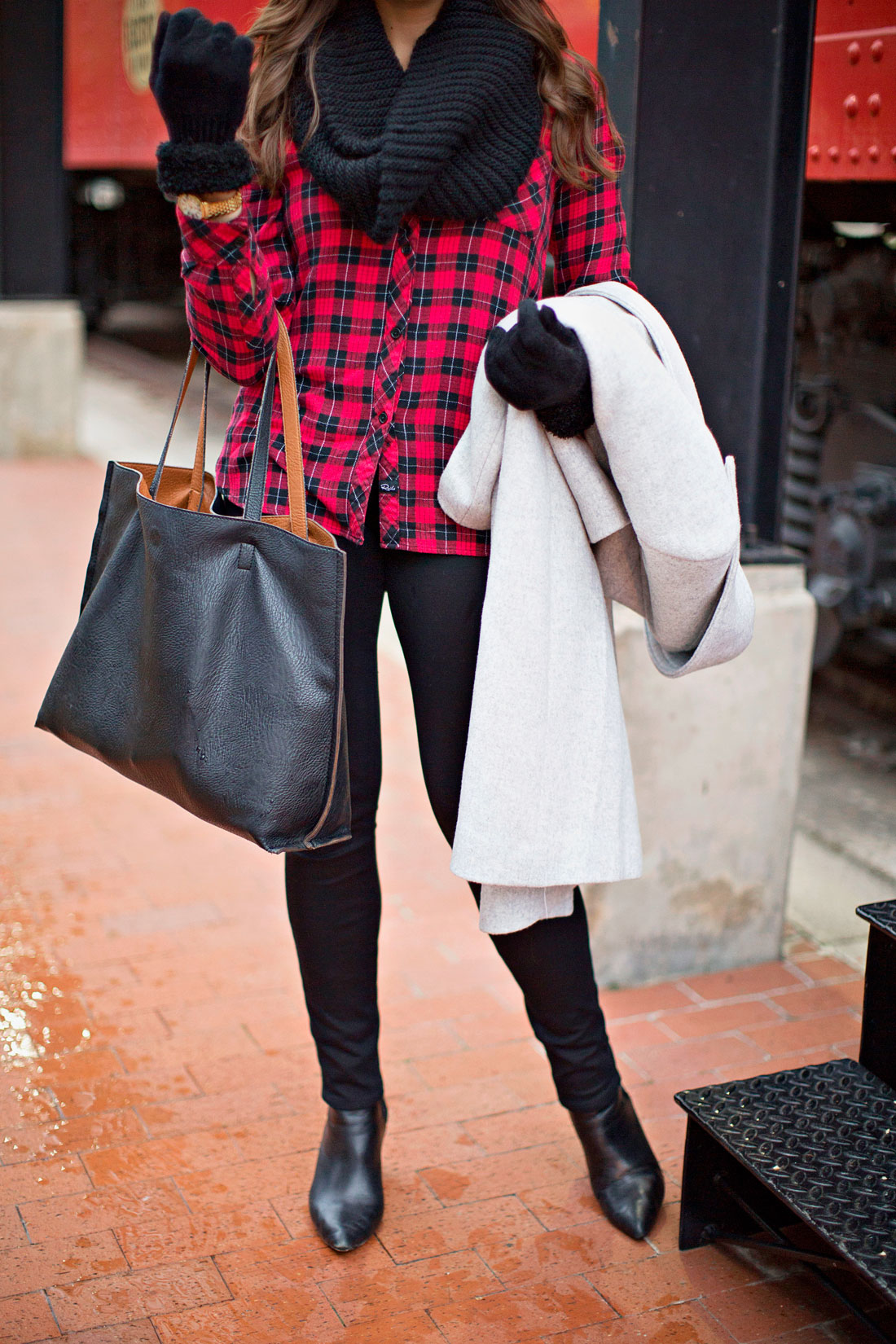 Best Luxury Designers Handbags fashion blogger Amanda uses Nordstrom reversible tote and black furry gloves for casual winter outfit