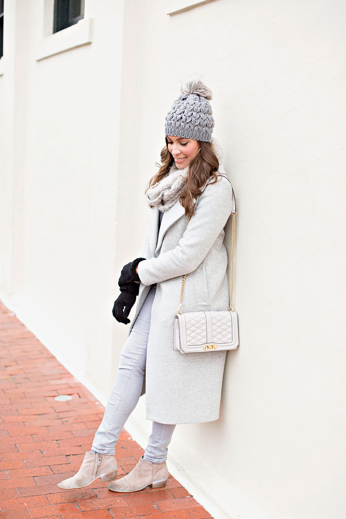 South Florida fashion blogger Amanda from Best Luxury Designers Handbags wears grey monochrome travel outfit
