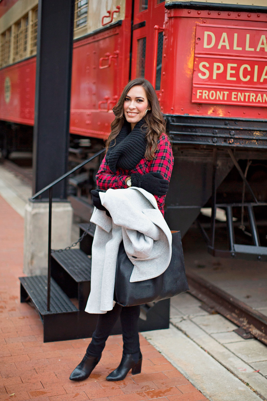 Best Luxury Designers Handbags fashion blogger wears a red and black buffalo plaid shirt with AG Jeans black leggings and club monaco daylina grey coat with aska collection troy booties carrying Nordstrom reversible tote
